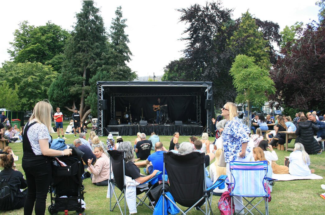 Festival stage with lights at dusk