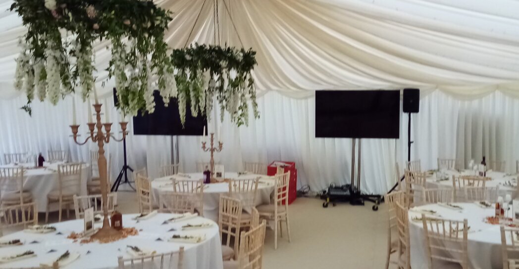 Camera on tripod filming a performance