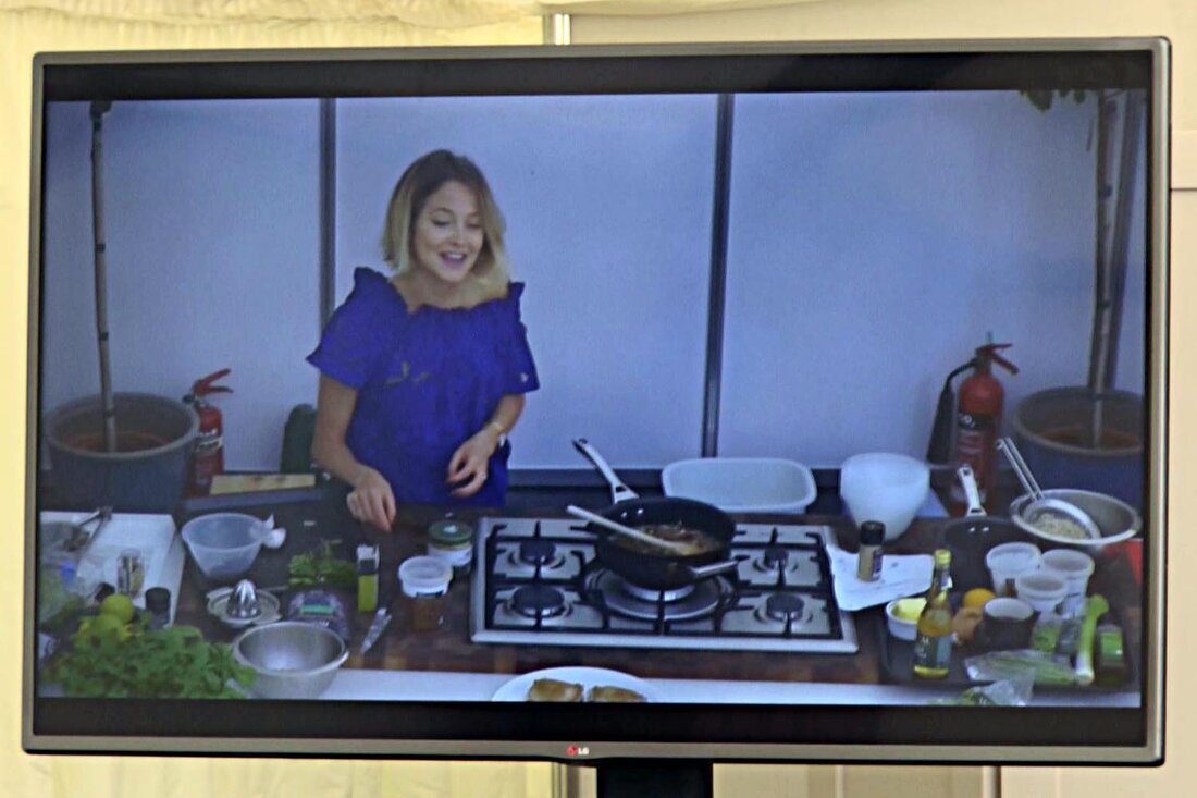 Two LED displays showing the same content in a conference room
